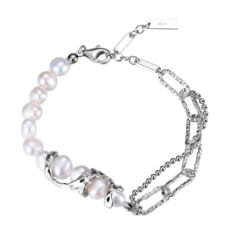 Silver irregular bracelet with pearls.