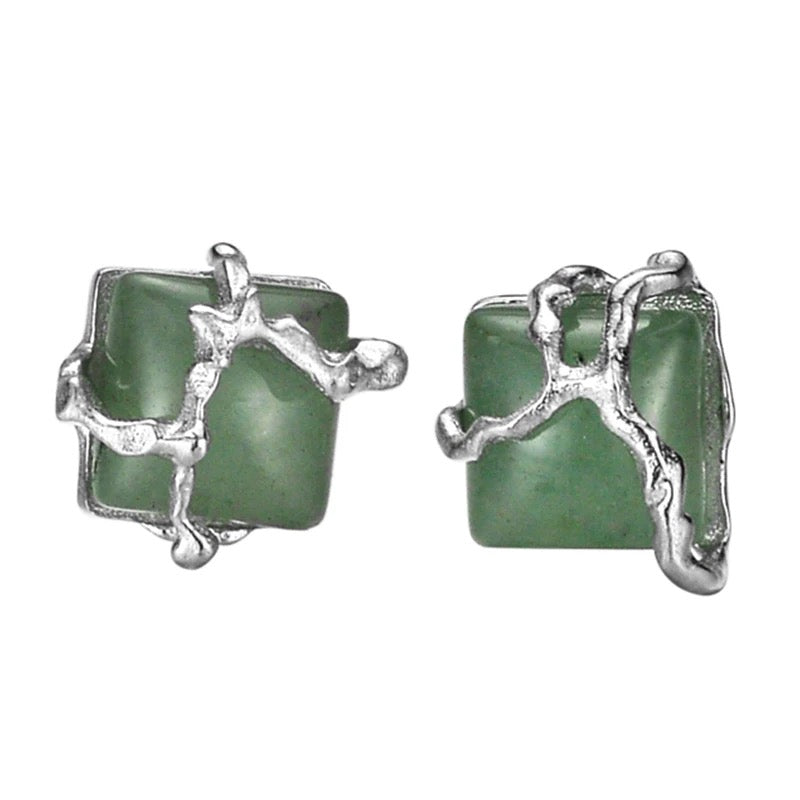 Earrings with green jade stone.