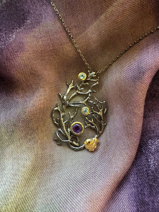 Sterling silver pendant necklace with amethyst and blue topaz