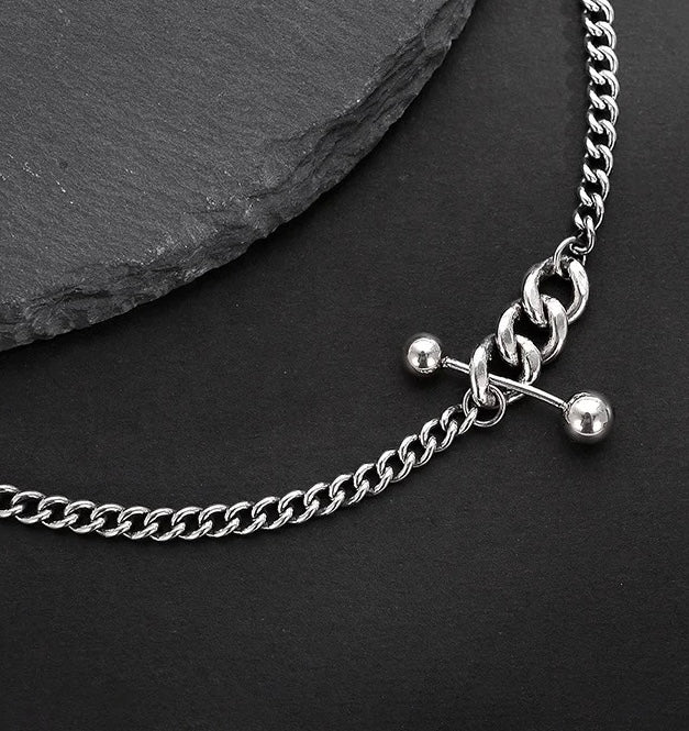 Silver necklace with decorative elements.
