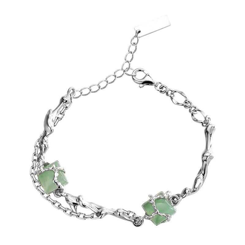 Silver bracelet with green jades.