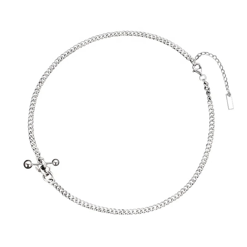 Silver necklace with decorative elements.