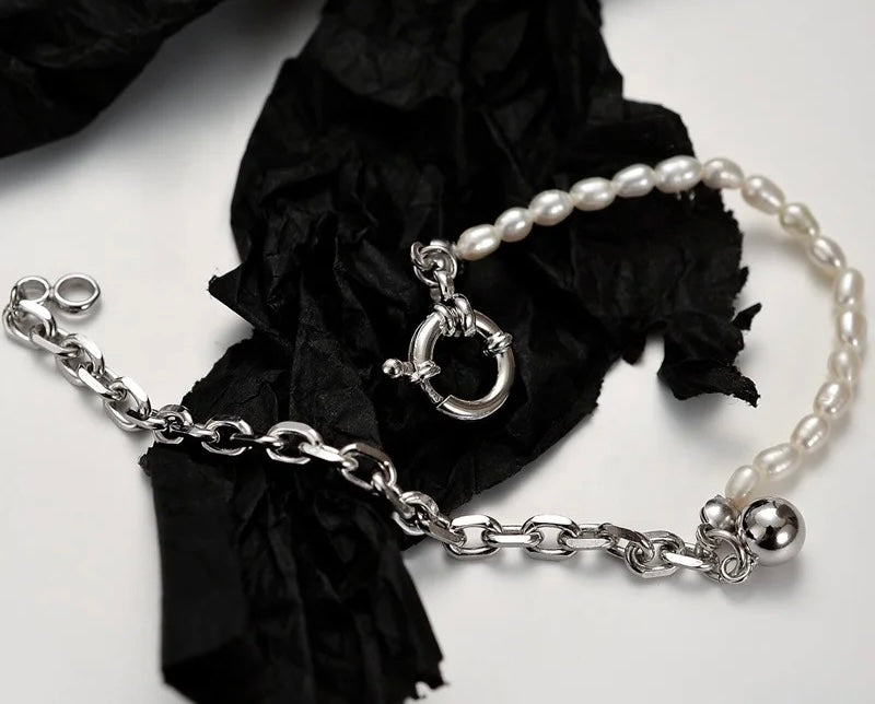 Silver pearl bracelet with big buckle.