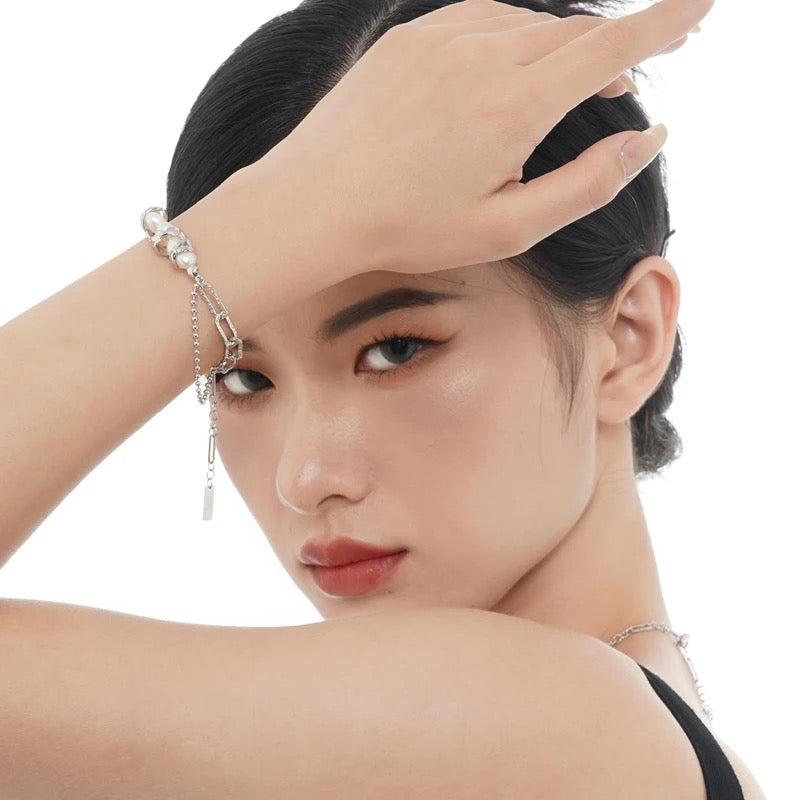 Silver irregular bracelet with pearls.