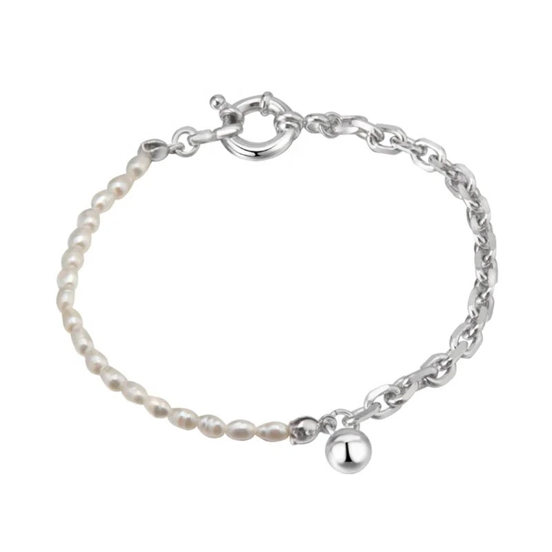 Silver pearl bracelet with big buckle.