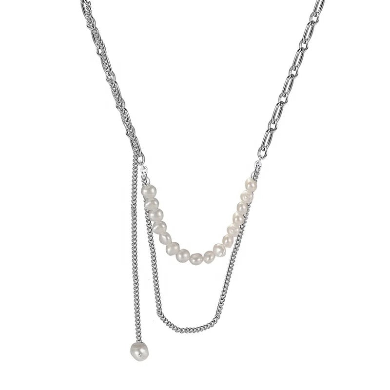 Necklace with chain and pearls.