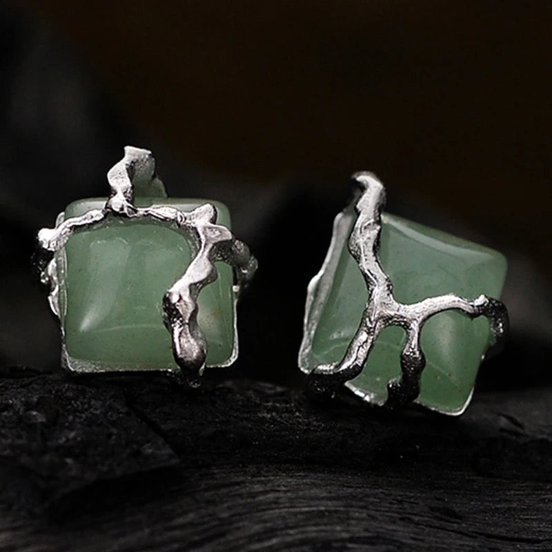 Earrings with green jade stone.