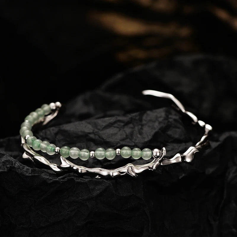 Branch shaped bracelet with green jade.