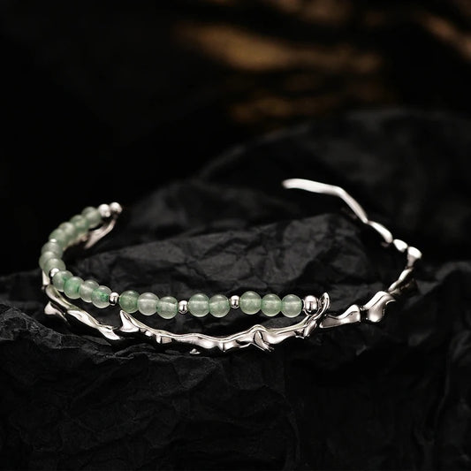 Branch shaped bracelet with green jade.