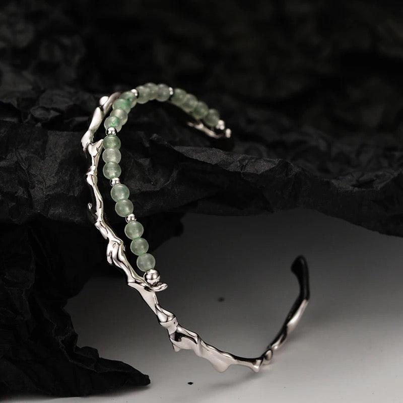 Branch shaped bracelet with green jade.