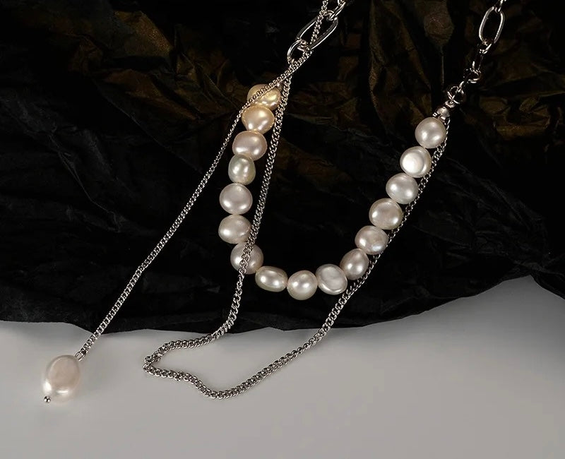 Necklace with chain and pearls.