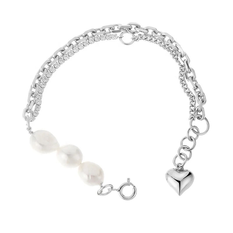 Pearl bracelet with zircons and heart pendant.