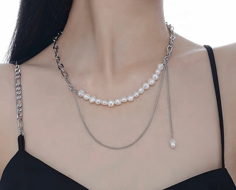 Necklace with chain and pearls.