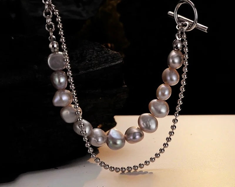 Necklace with gray pearls.