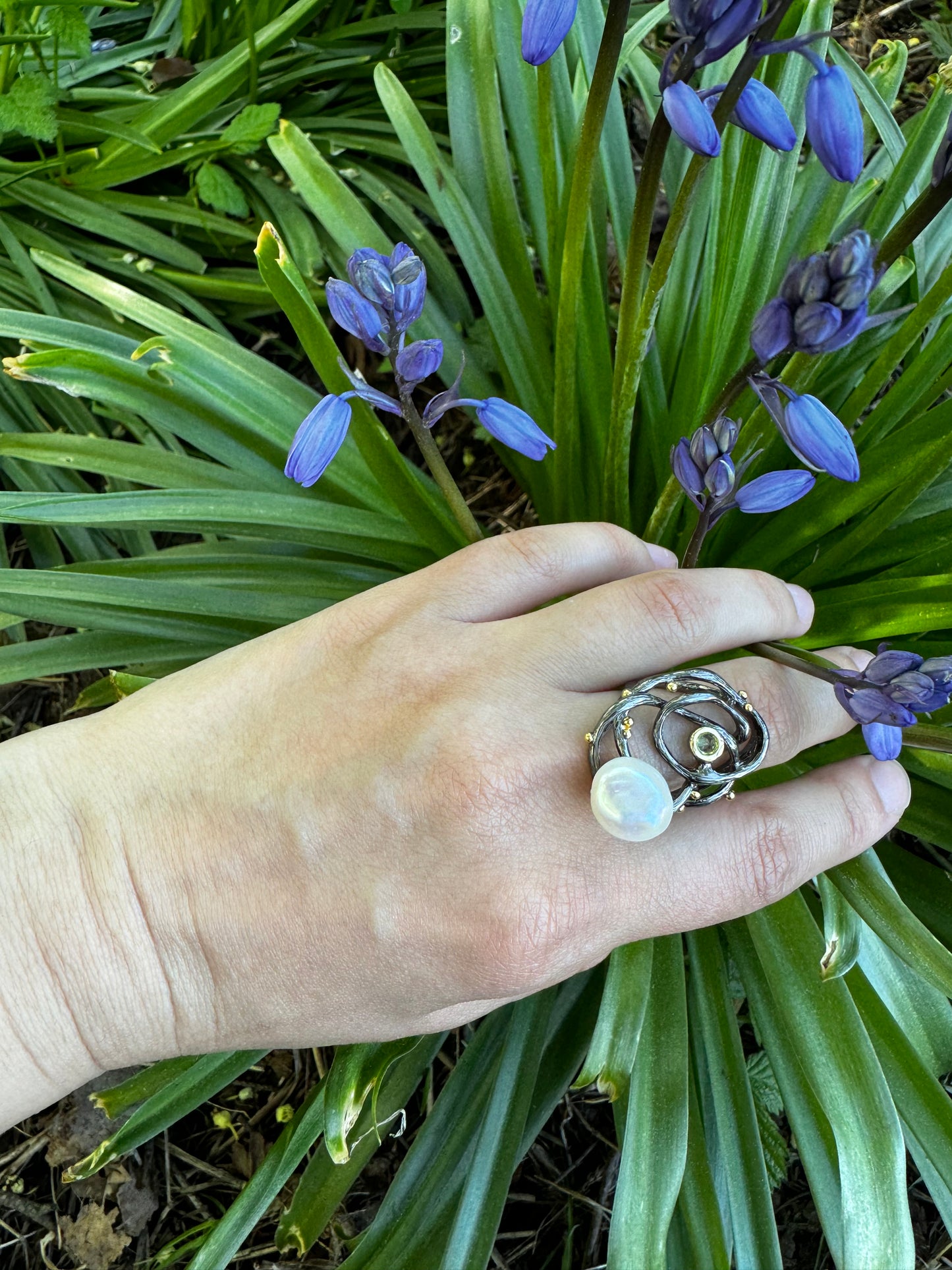 Sterling silver ring with baroque pearl and peridot