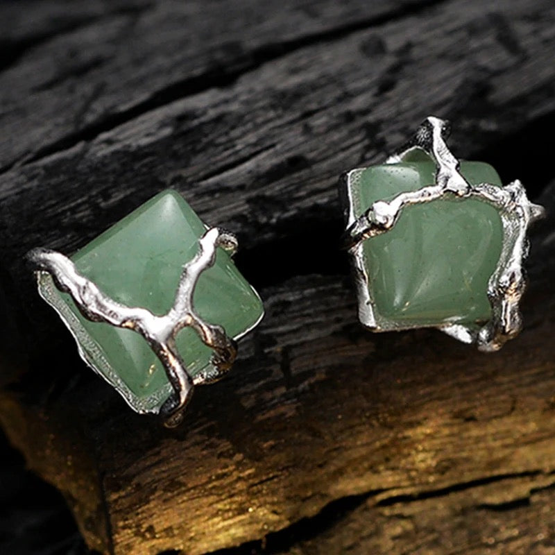 Earrings with green jade stone.