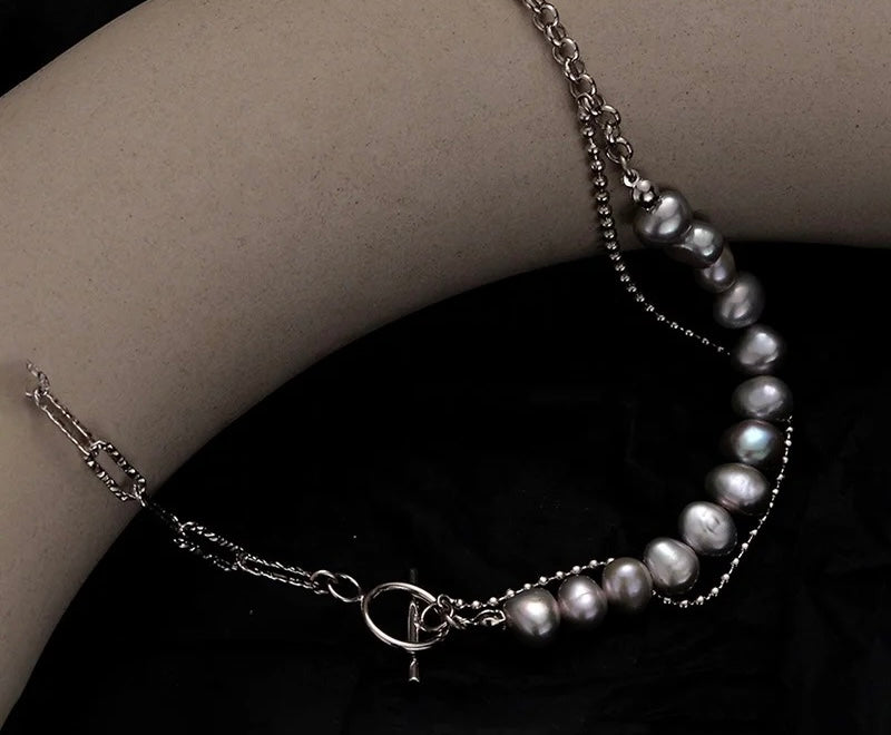 Necklace with gray pearls.