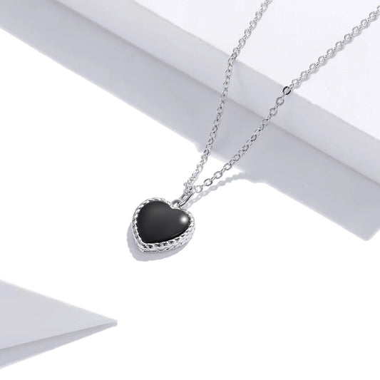 Silver necklace with black heart