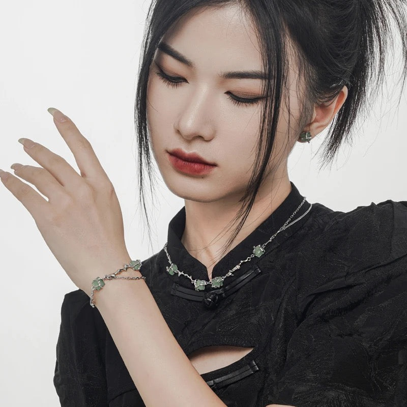 Silver bracelet with green jades.