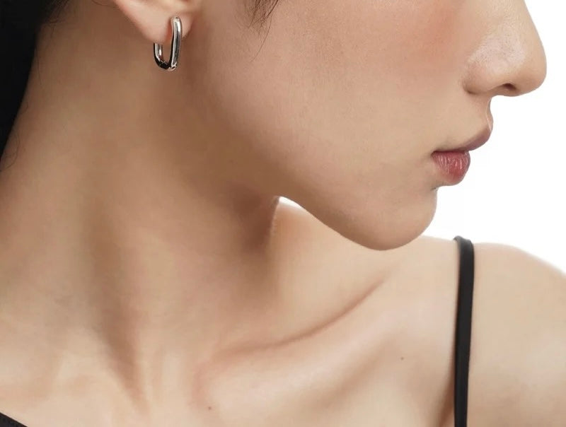 Silver earrings.