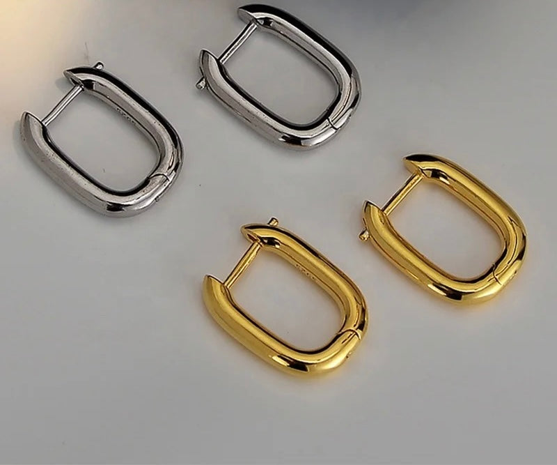 Silver earrings.